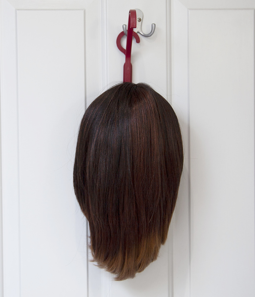 wig hanger on door